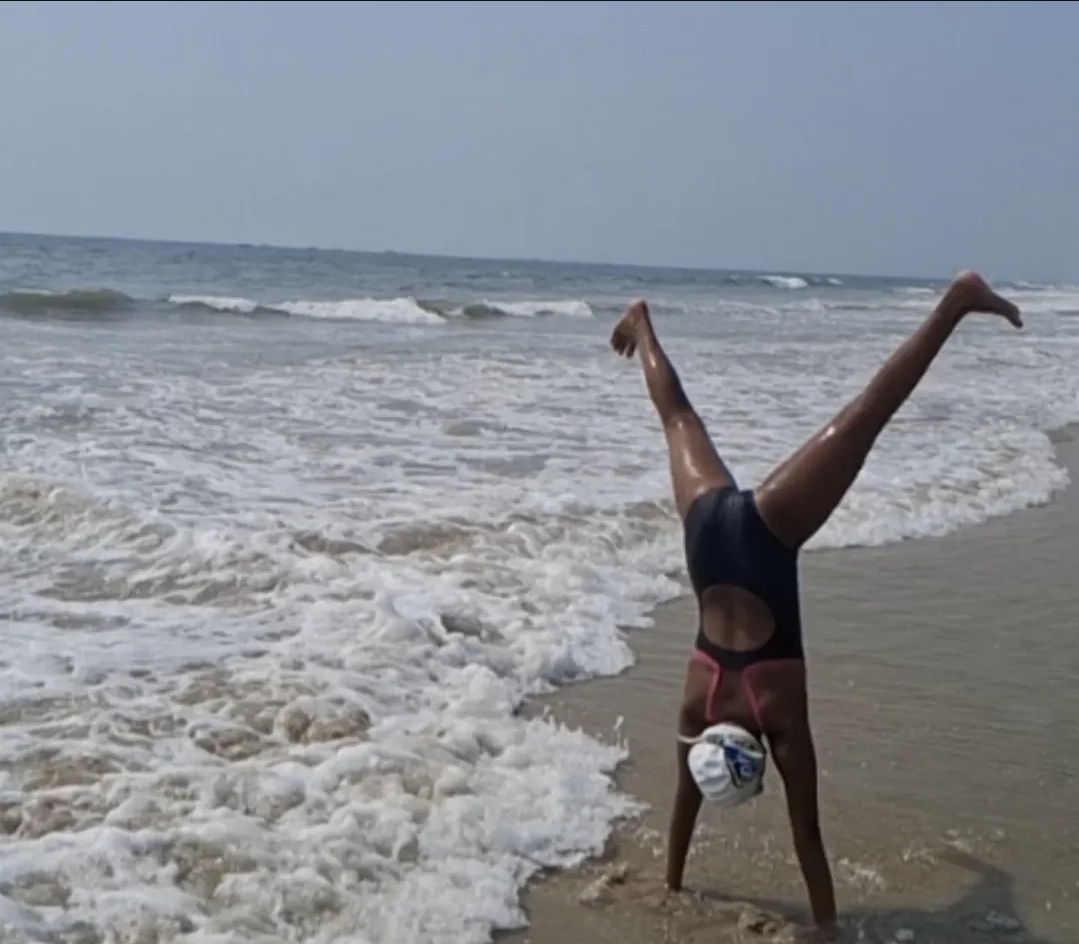 Shagun Sharma handstand at beach